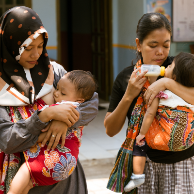 two womens with babys