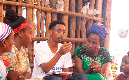 Young people engaged in a conversation